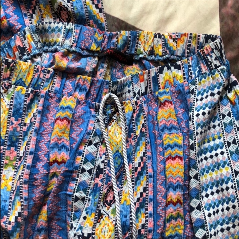 Flare print with tassels.